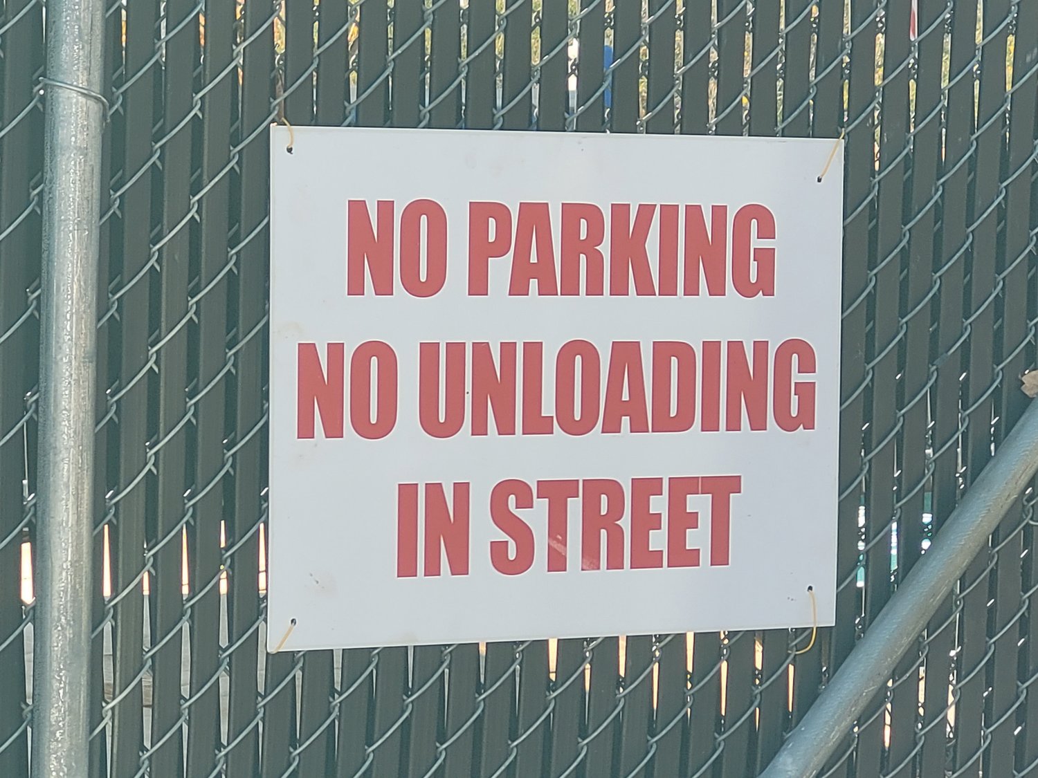NO PARKING: New signs hang on the fence at J&S Scrap Metal, warning customers not to park on Starr Street. Residents had been complaining about customers blocking traffic on Starr Street.